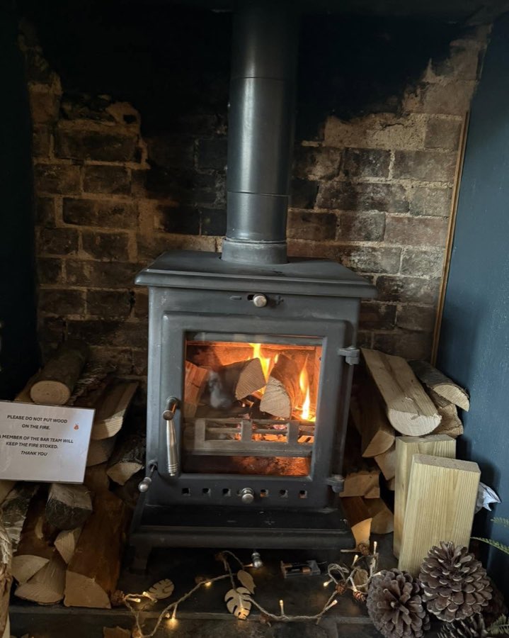 The log burner lit in the bar