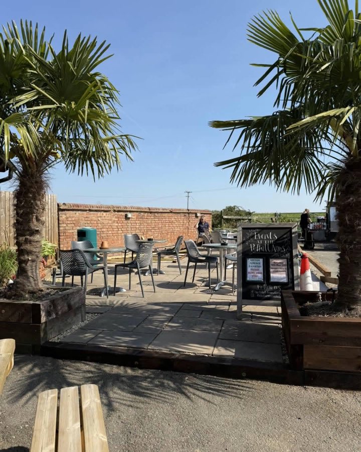 The sun-drenched patio beside the pub